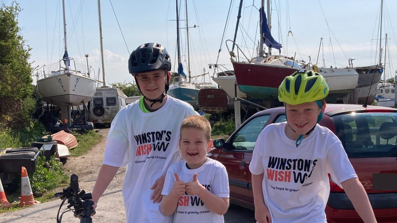 Three young boys in Winston's Wish t-shirts