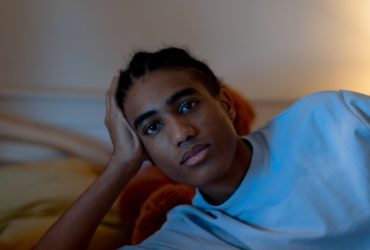 Teenage boy looking thoughtfully at camera - suicide bereavement support
