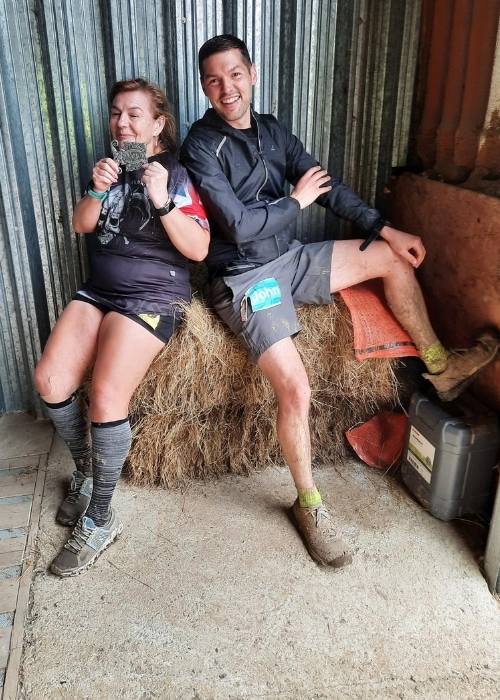marie debont-booth and friend sitting on hay bale showing runners