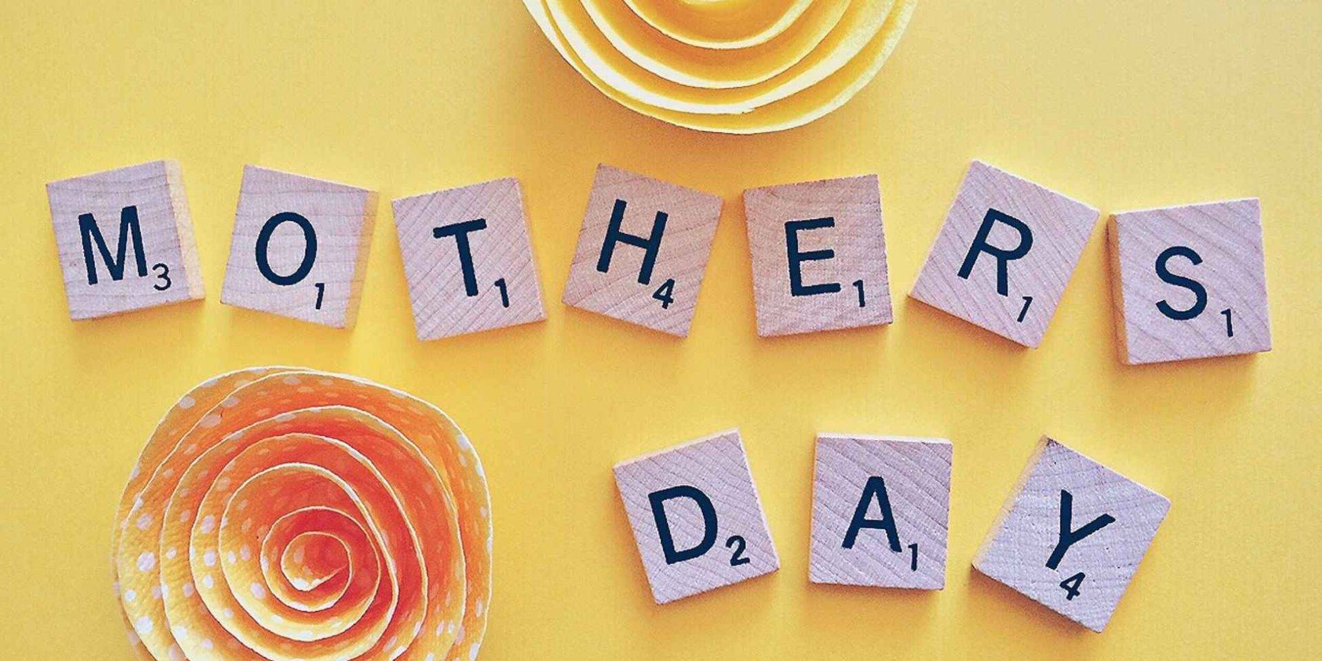 Mother's Day in scrabble letters on yellow background