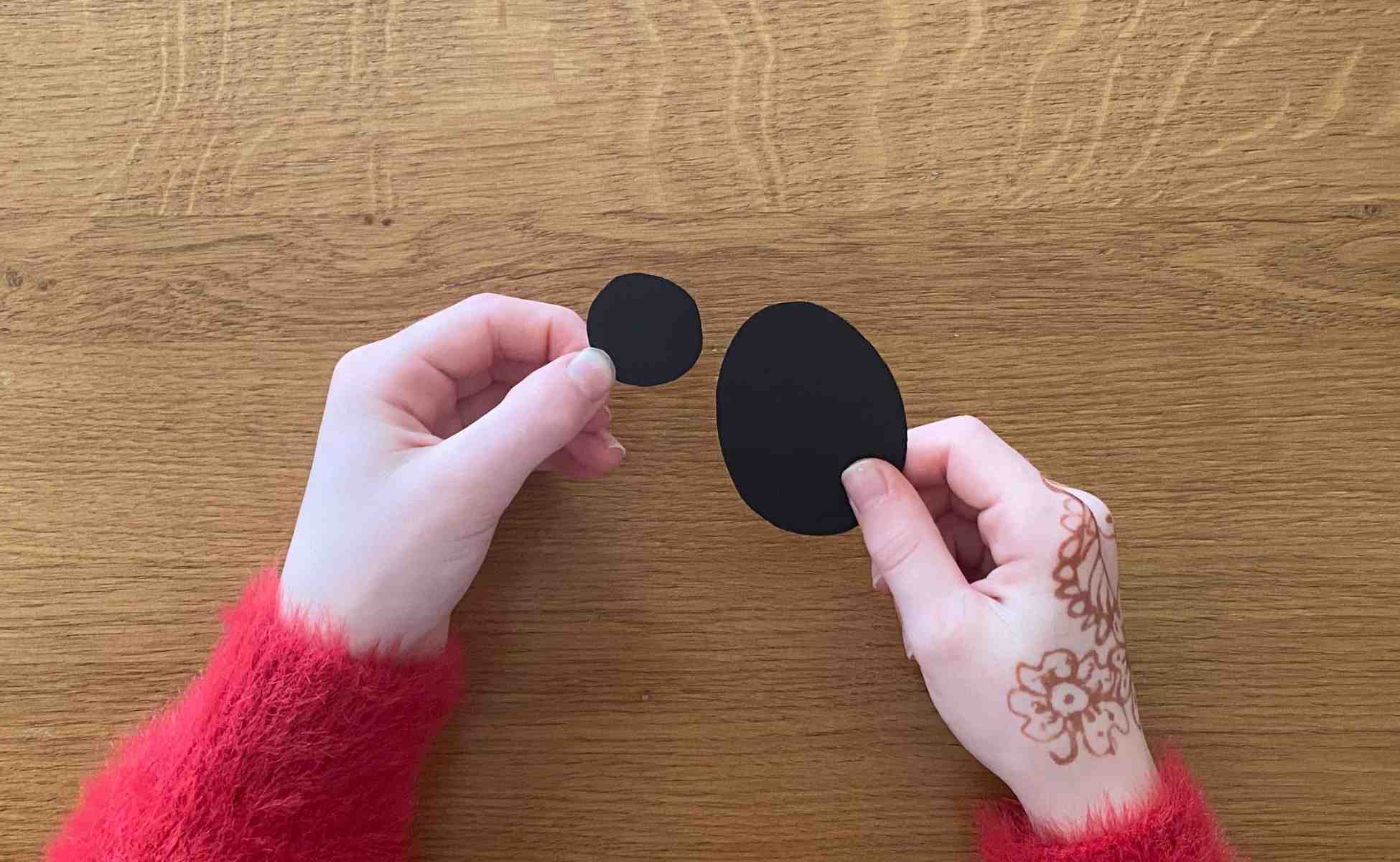 Step 1 Cut out a small circle and a larger oval from black paper - Make a spider - Winston's Wish