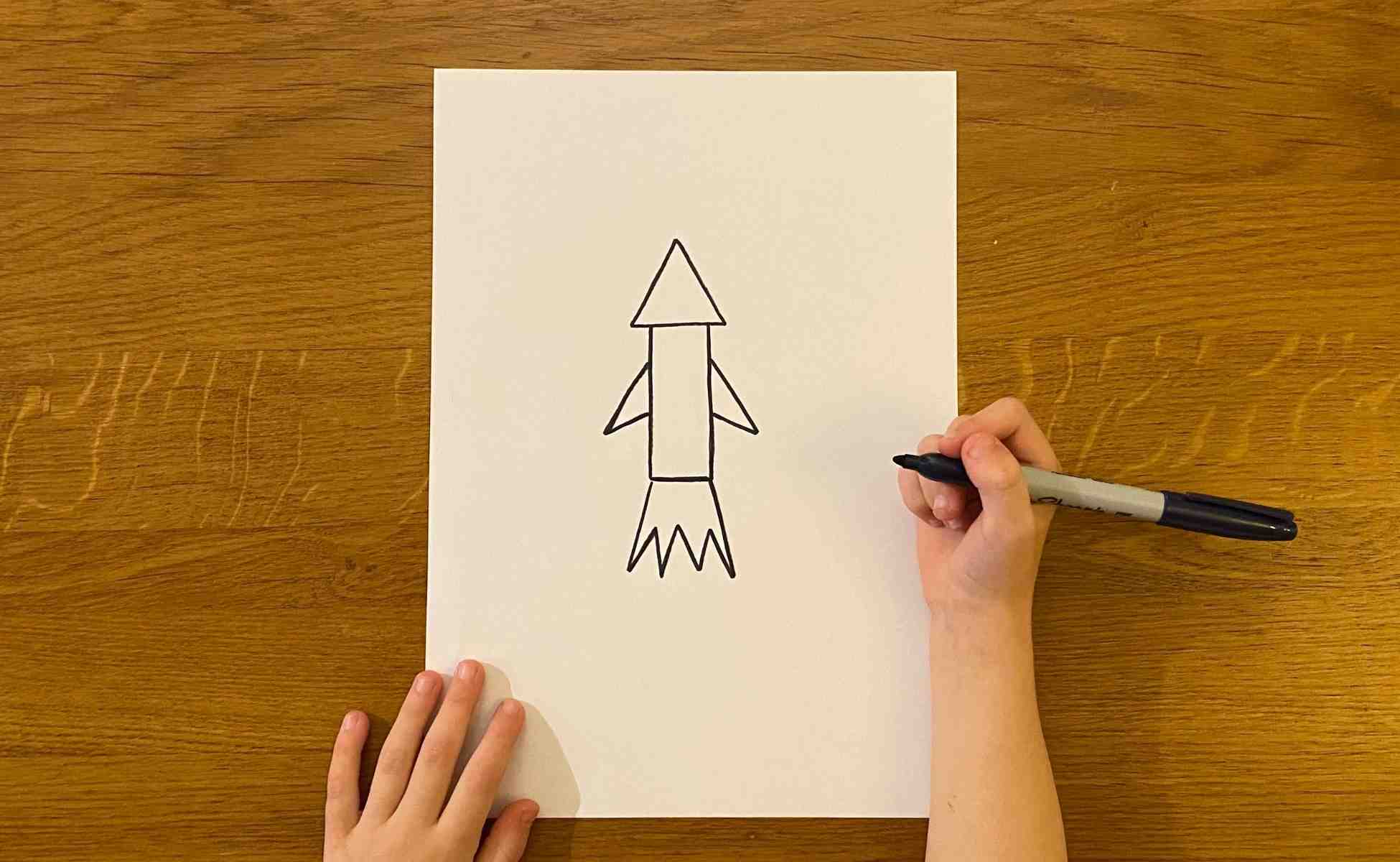 Step 1 Draw a rocket shape on a piece of paper - Straw Rocket activity - Winston's Wish