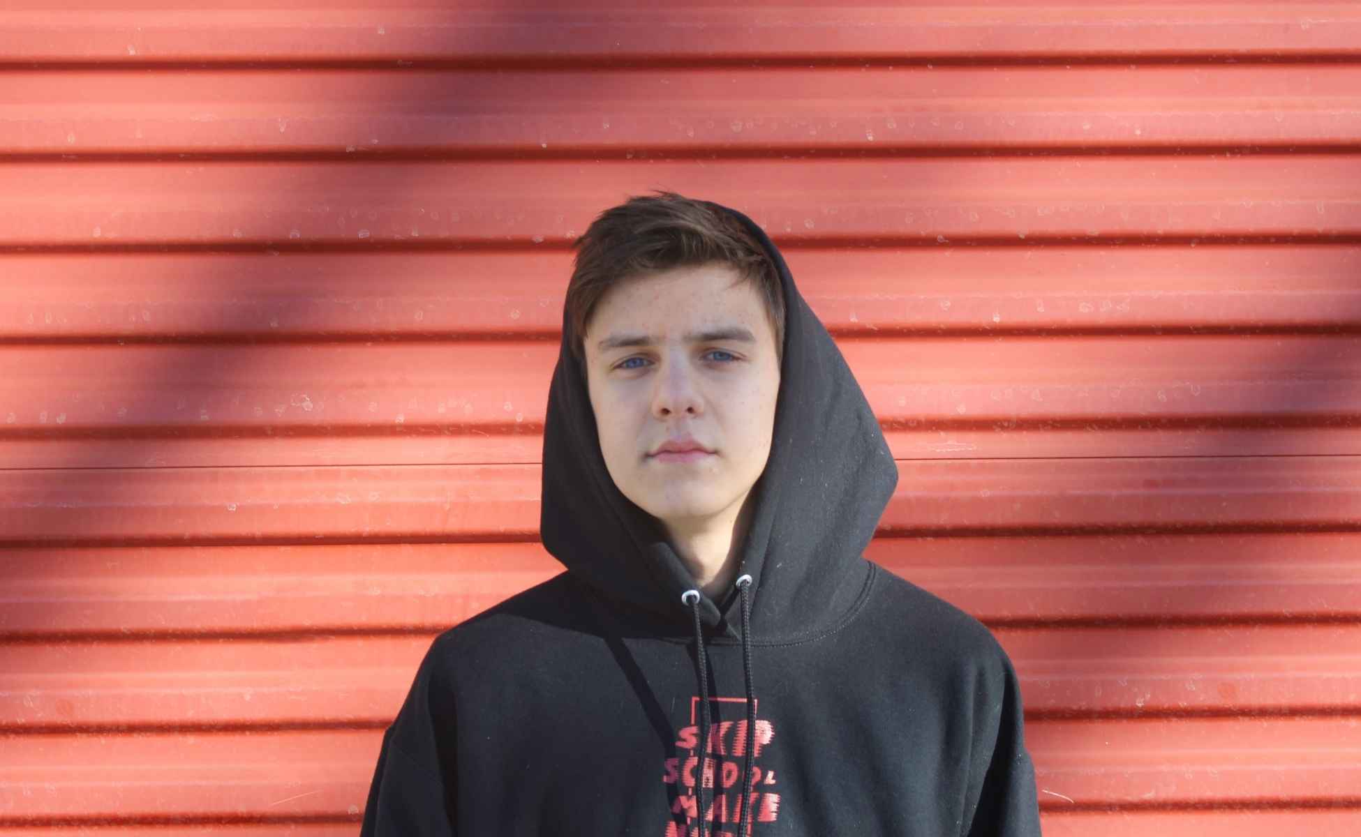 Teenage boy in a hoodie staring at the camera - Winston's Wish Youth Survey