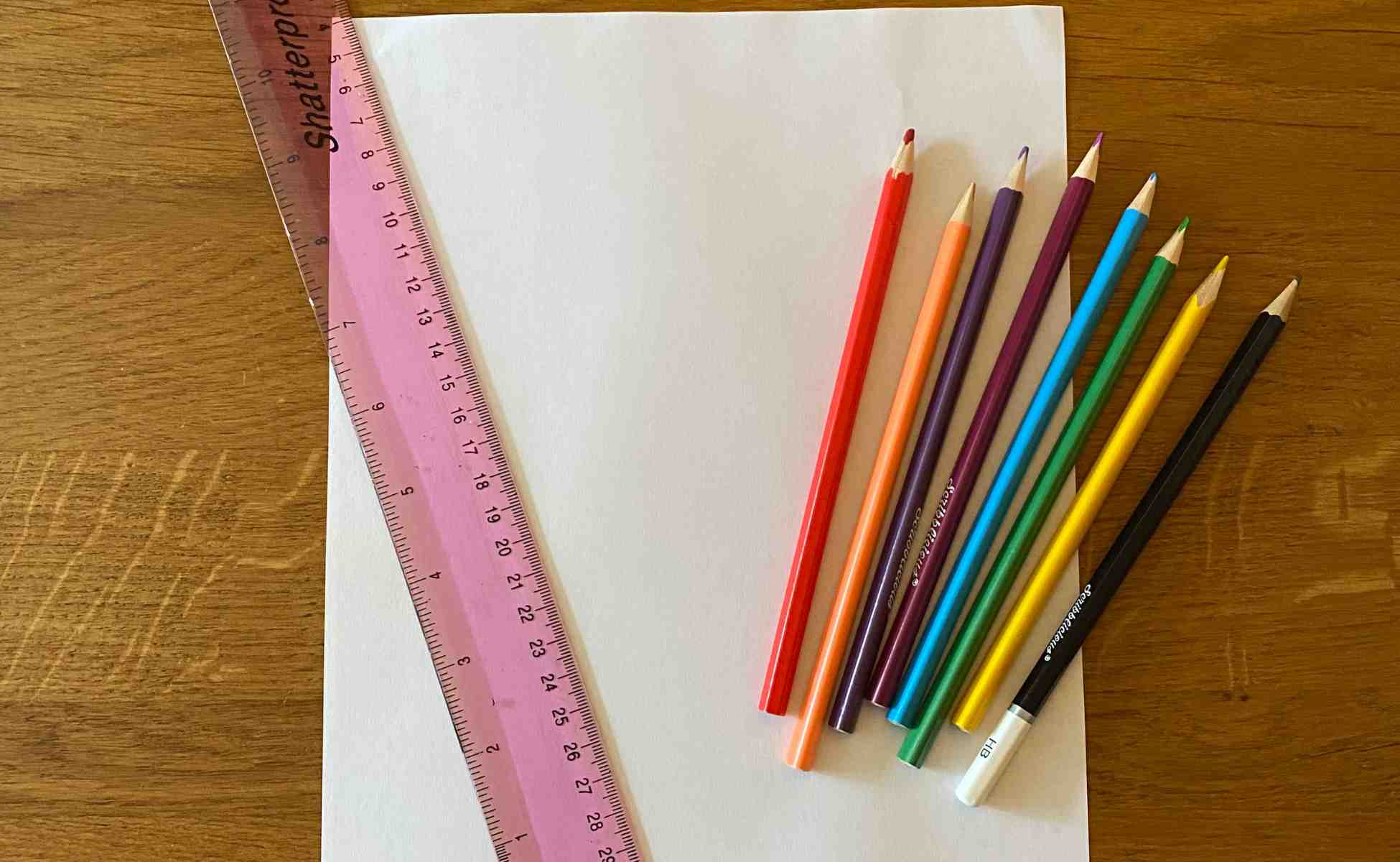 Photo of the material you need to do the Rainbow Review make and talk activity - paper, coloured pencils and a ruler - Winston's Wish