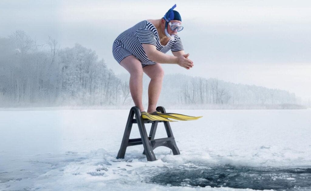 Man diving into an icy lake