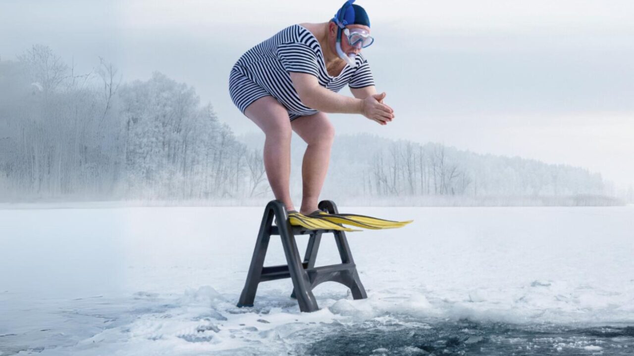 Man diving into an icy lake