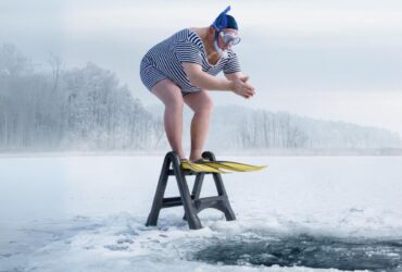 Man diving into an icy lake