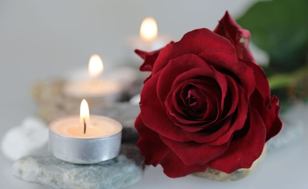 Candle and a red rose