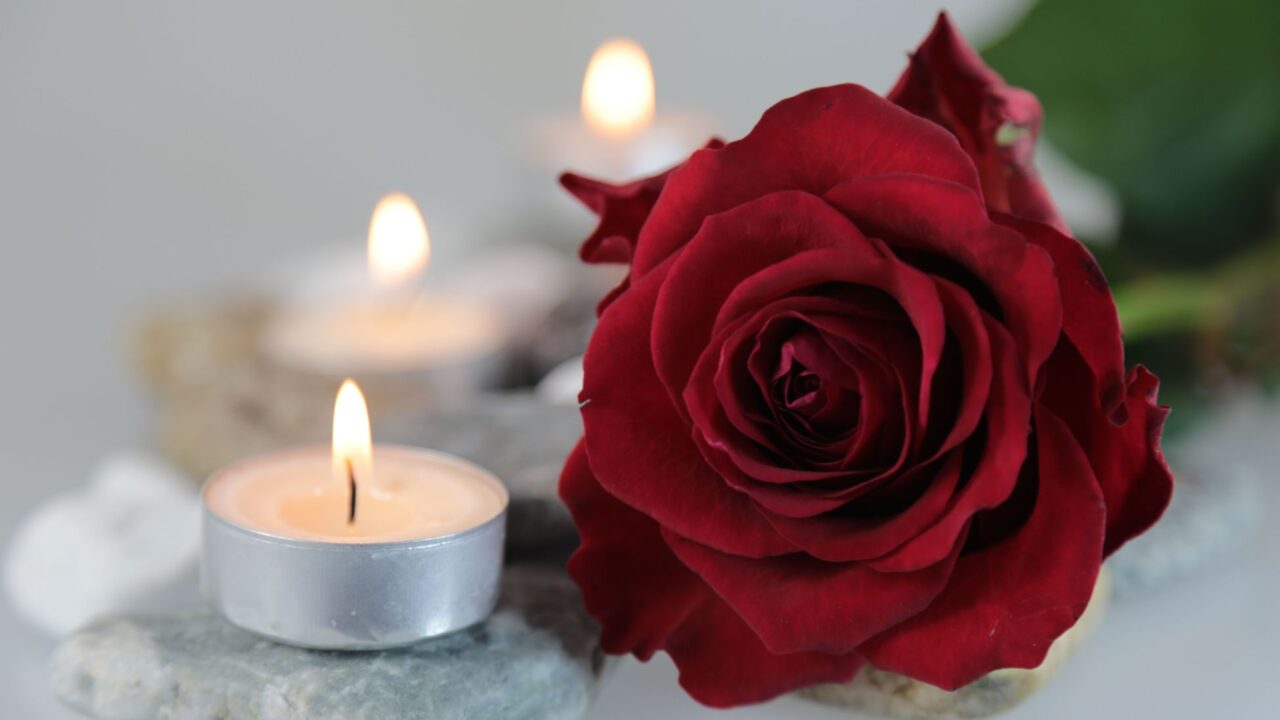 Candle and a red rose