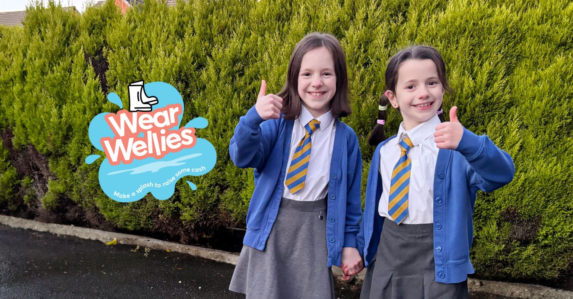 Young girls wearing wellies for Wear Wellies Day