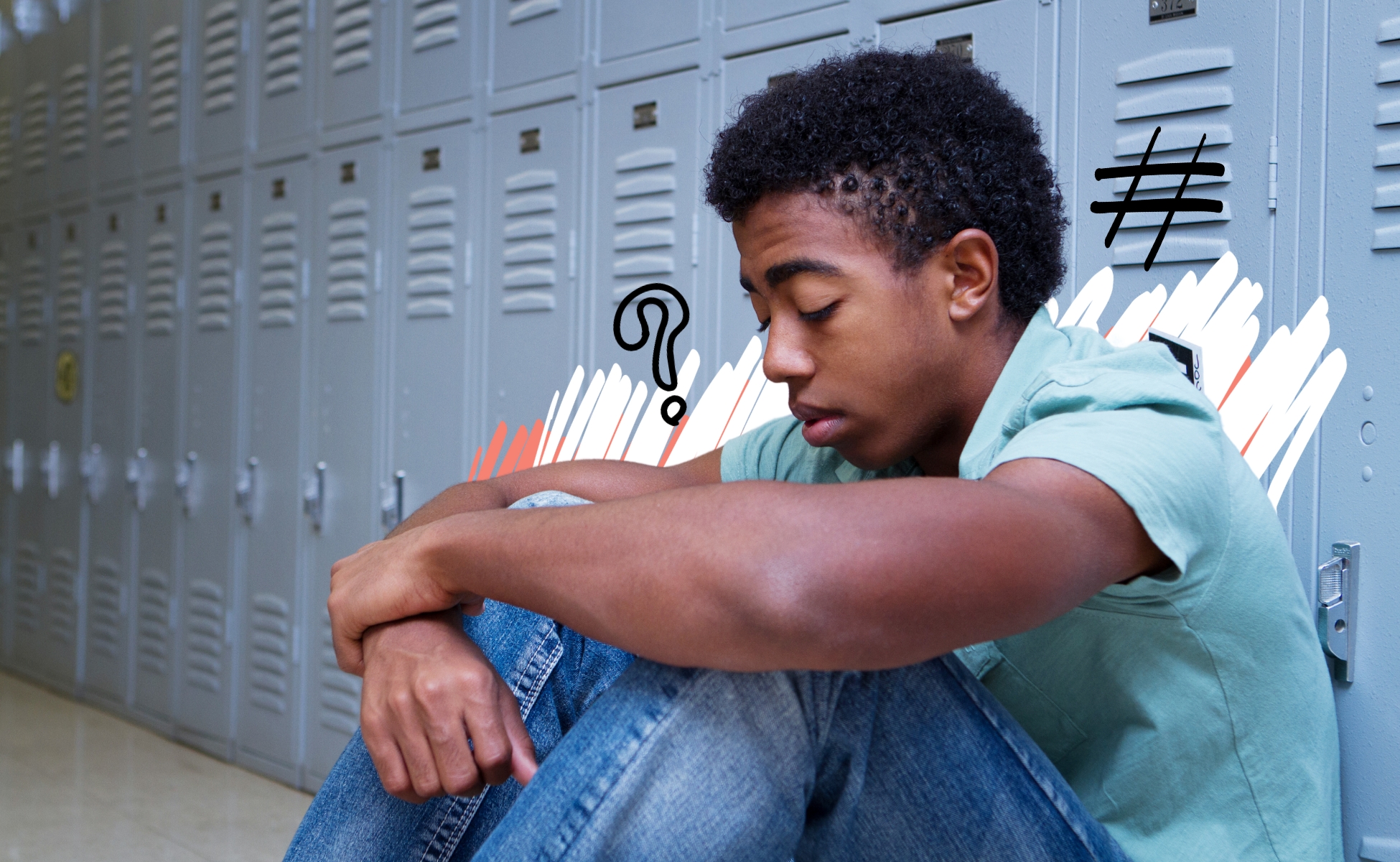 Young male sat beside school lockers, grieving