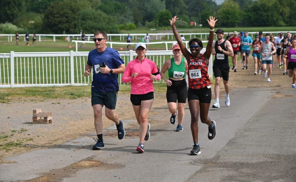 Runners cheering during the Cheltenham Running Festival