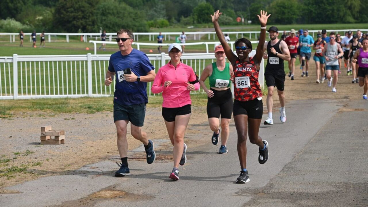 Runners cheering during the Cheltenham Running Festival